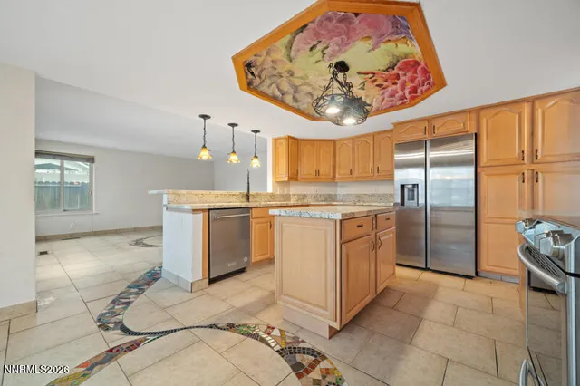 a kitchen with a stove top oven cabinets and a refrigerator
