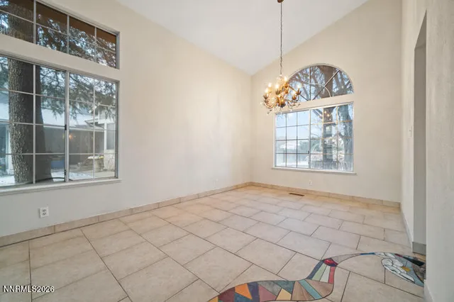 a view of an empty room with windows