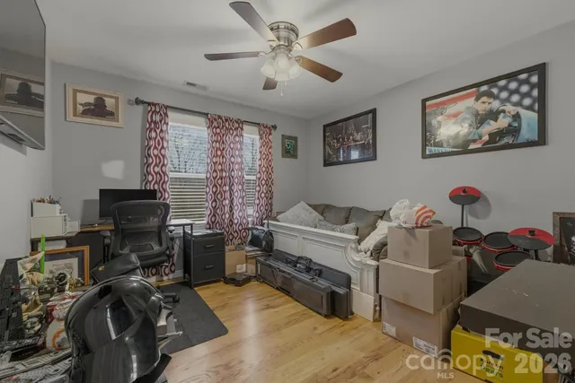 a bedroom with furniture and a window