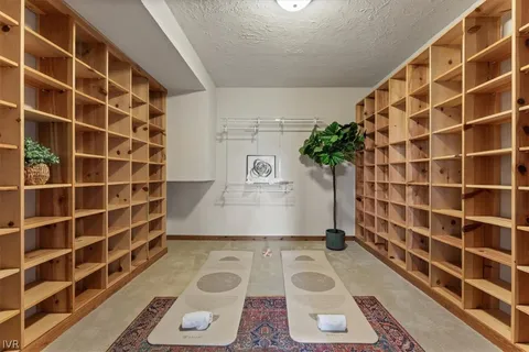 a bedroom with a bed and glass window