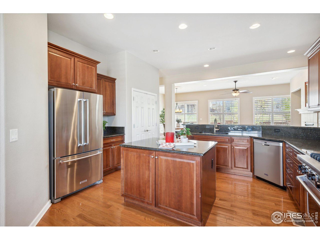 4514 Silver Mountain Loop Broomfield, CO 80023 - Photo 11 of 39 a kitchen with refrigerator and cabinets