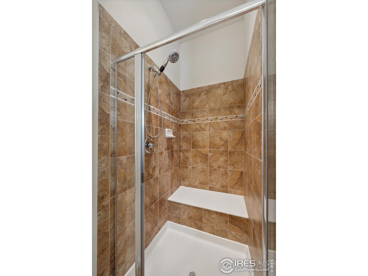 4514 Silver Mountain Loop Broomfield, CO 80023 - Photo 16 of 39 a bathroom with a shower and a mirror