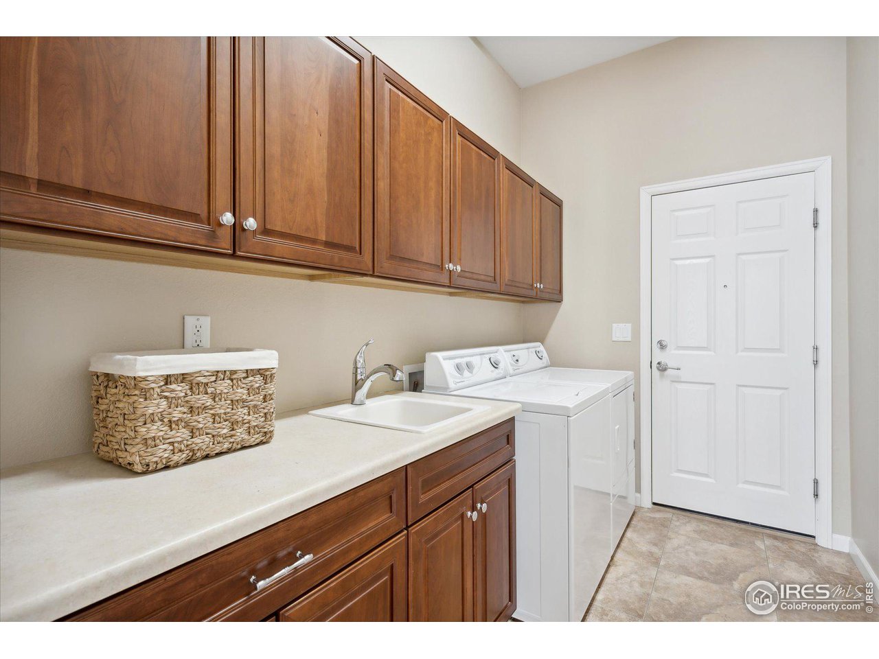 4514 Silver Mountain Loop Broomfield, CO 80023 - Photo 20 of 39 a kitchen with a sink and cabinets