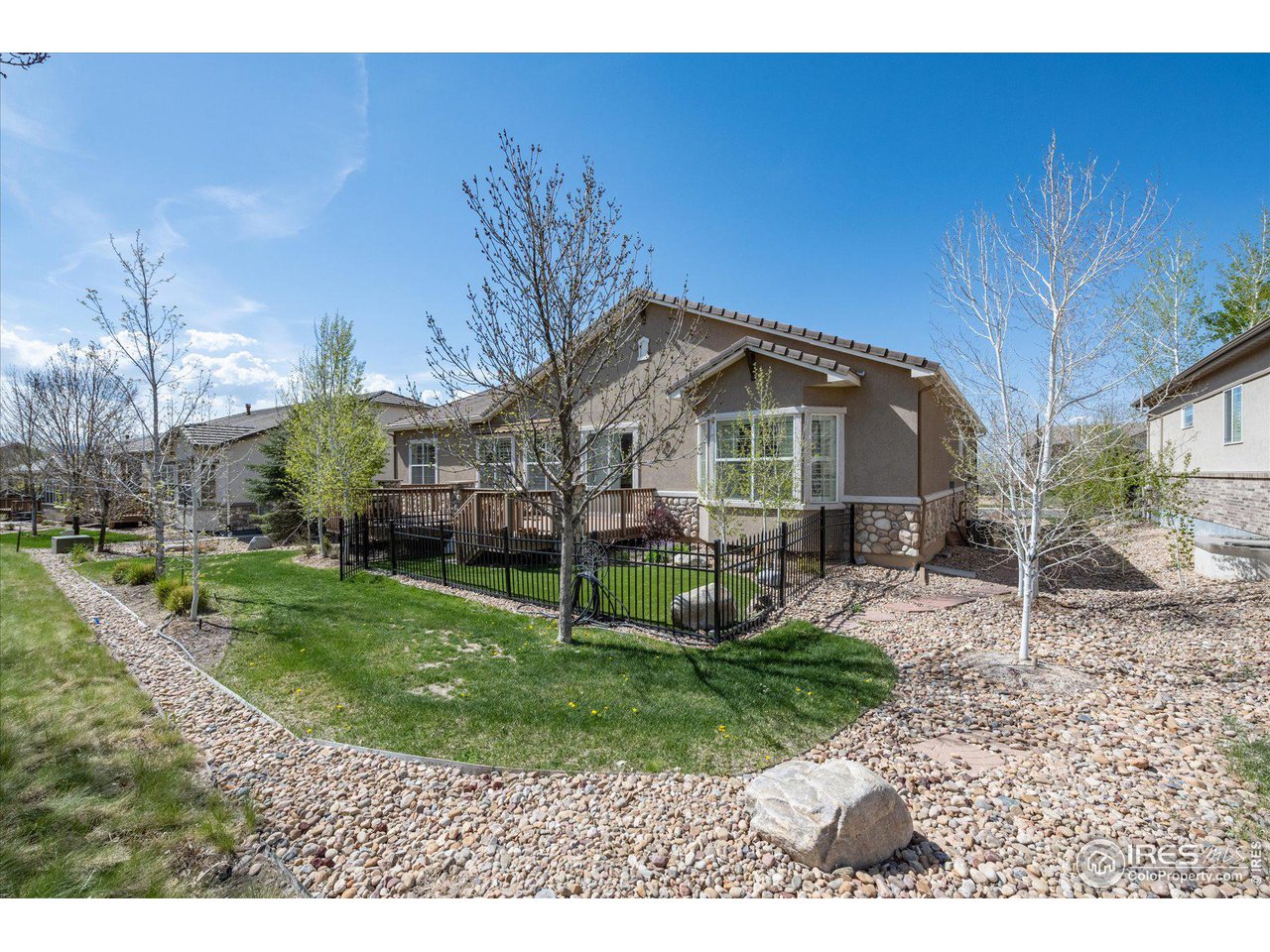 4514 Silver Mountain Loop Broomfield, CO 80023 - Photo 26 of 39 a front view of a house with a garden