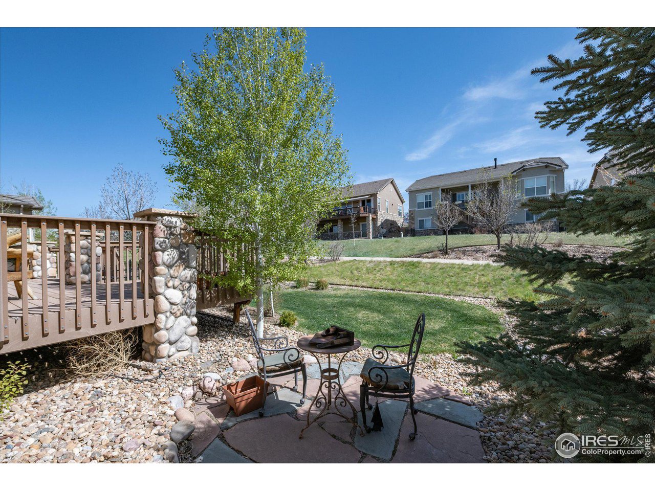4514 Silver Mountain Loop Broomfield, CO 80023 - Photo 29 of 39 a view of a chair and table in backyard