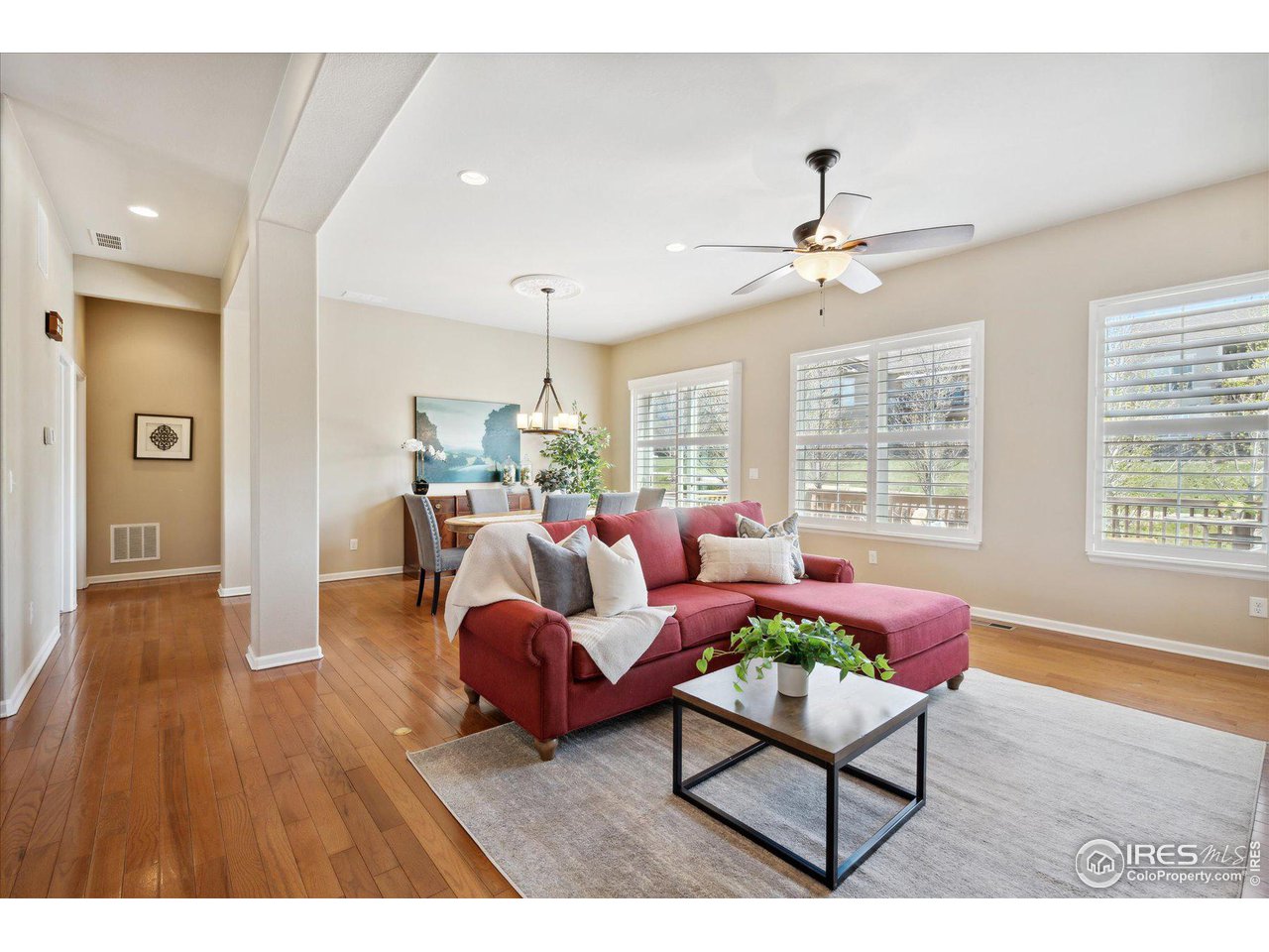 4514 Silver Mountain Loop Broomfield, CO 80023 - Photo 3 of 39 a living room with furniture and a large window
