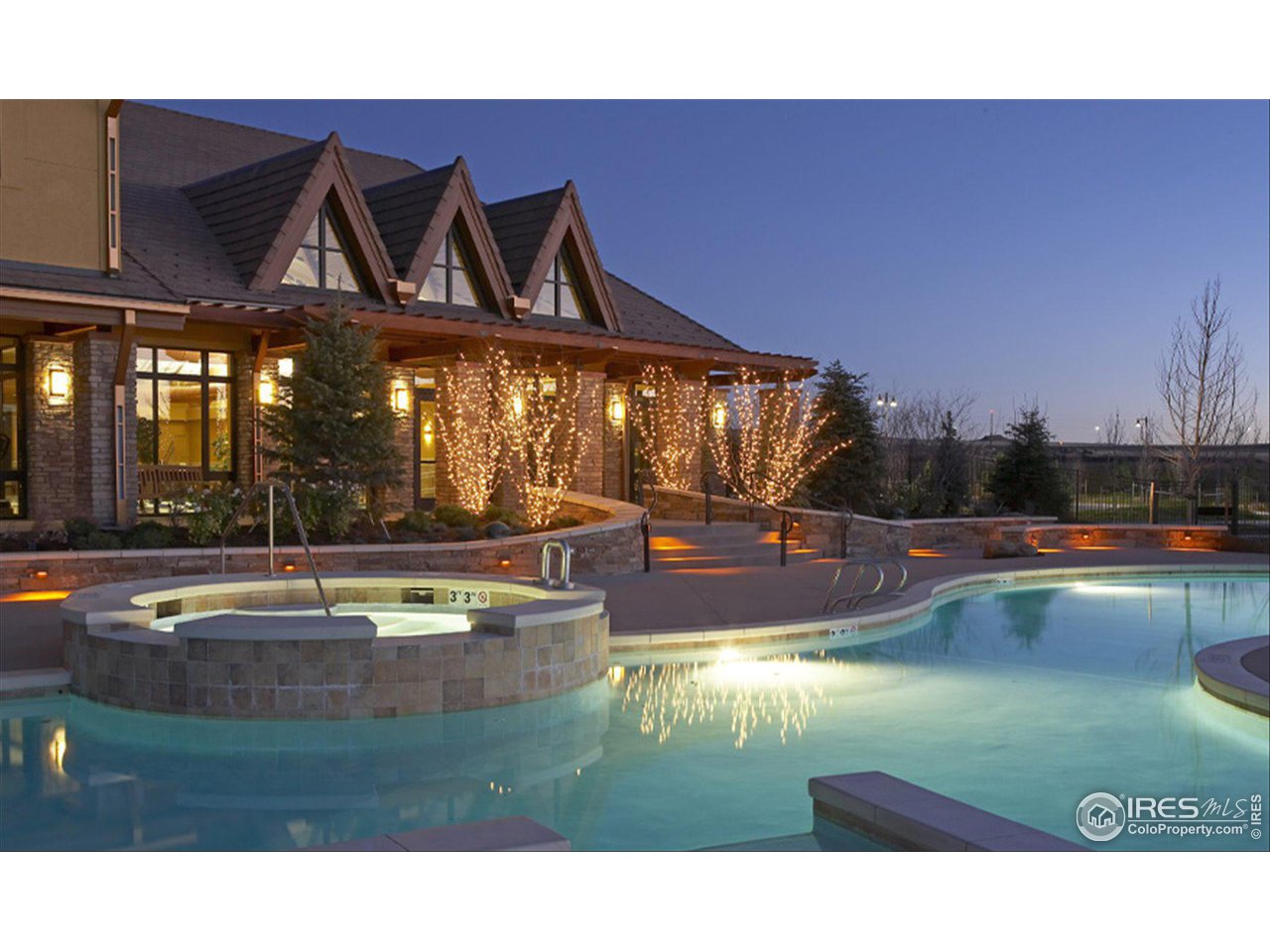 4514 Silver Mountain Loop Broomfield, CO 80023 - Photo 35 of 39 a view of a swimming pool and lounge chairs