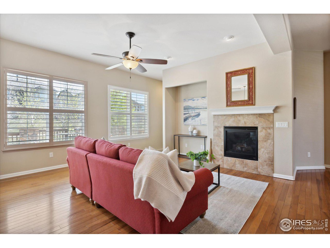 4514 Silver Mountain Loop Broomfield, CO 80023 - Photo 5 of 39 a living room with furniture fireplace and window