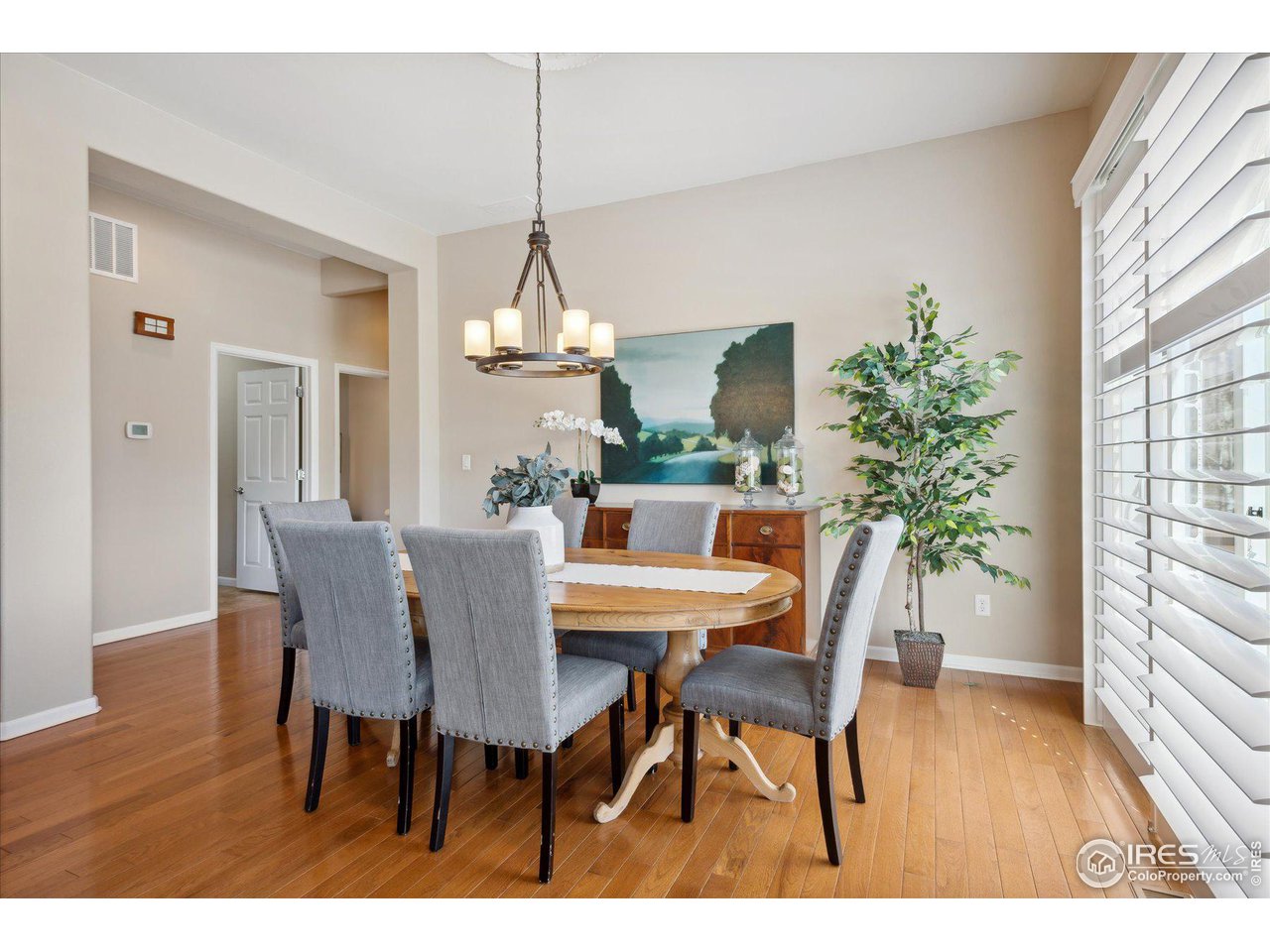 4514 Silver Mountain Loop Broomfield, CO 80023 - Photo 6 of 39 a view of a dining room with furniture window and wooden floor