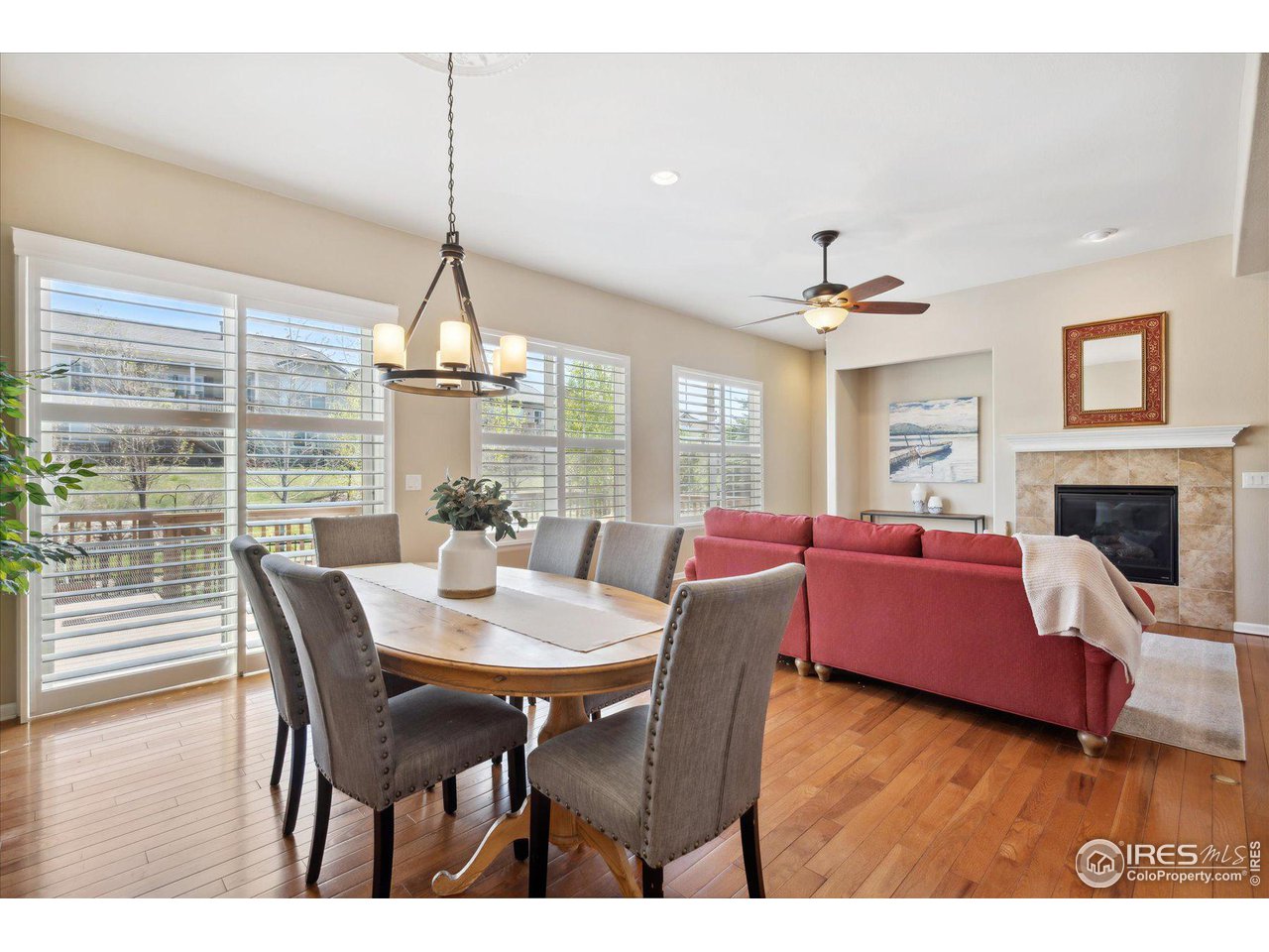 4514 Silver Mountain Loop Broomfield, CO 80023 - Photo 8 of 39 a view of a dining room with furniture window and wooden floor