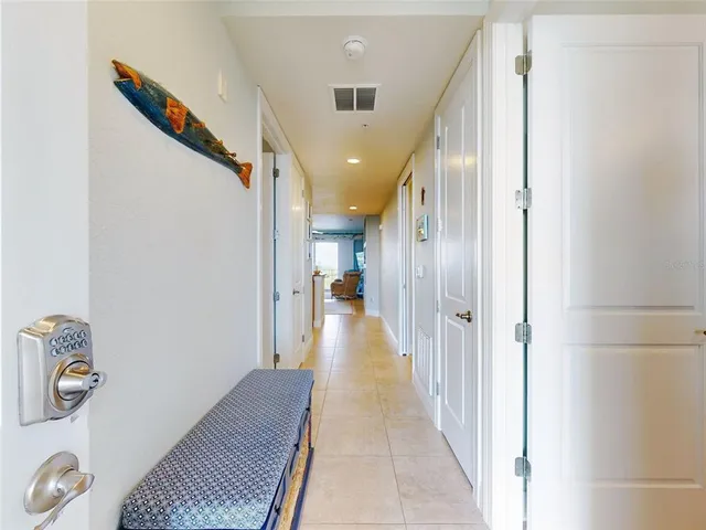 a kitchen with refrigerator and cabinets