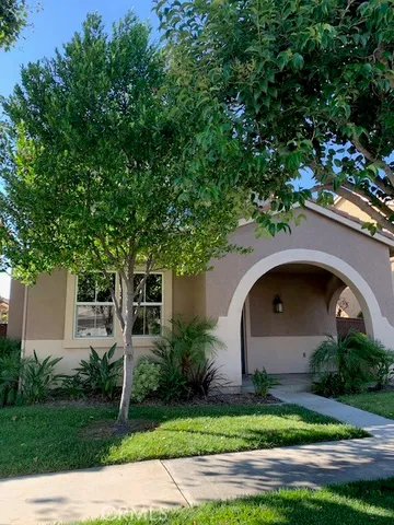 a front view of house with garden