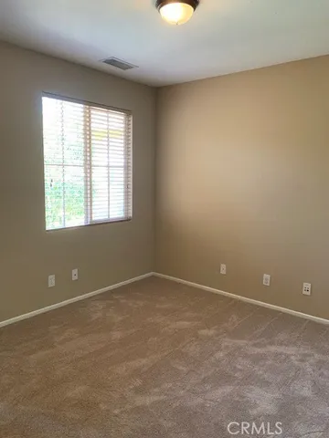 an empty room and window