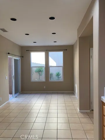 a view of empty room with windows