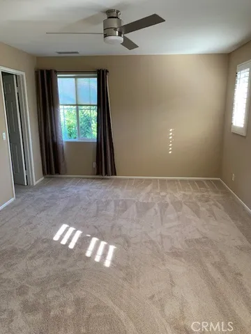 a view of a big room with windows