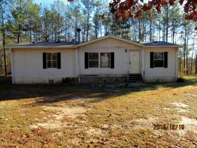 368 Moncrief Road Roberta, GA 31078 - Photo 1 of 1 a house with trees in the background