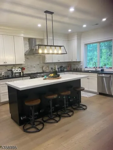 a kitchen with a sink cabinets and window