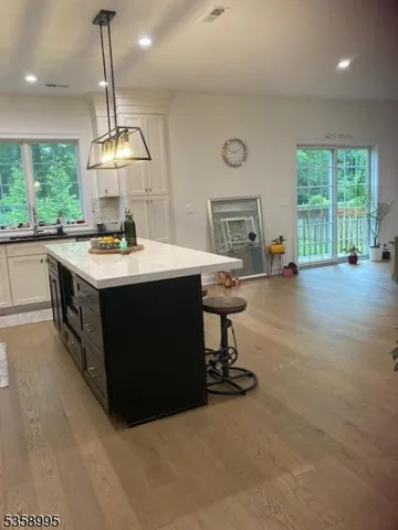 a kitchen with a sink a counter top space and appliances