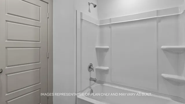a bathroom with a shower and toilet