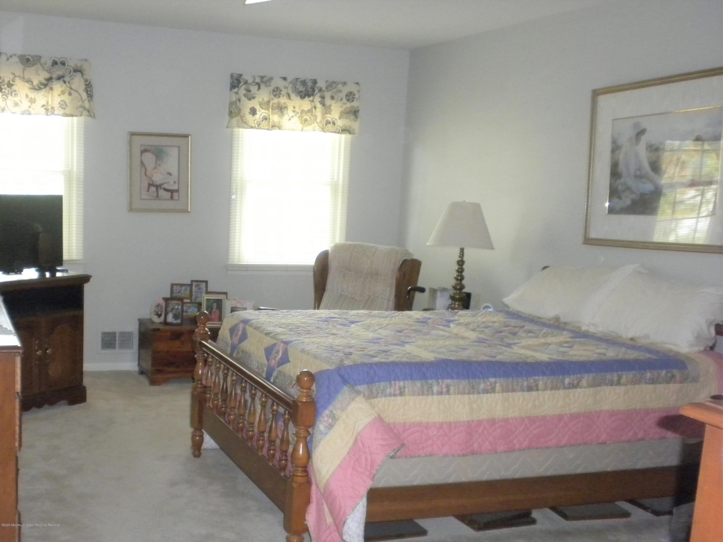 28 Ridge Road West Long Branch, NJ 07764 - Photo 11 of 19 a bedroom with a bed and a window