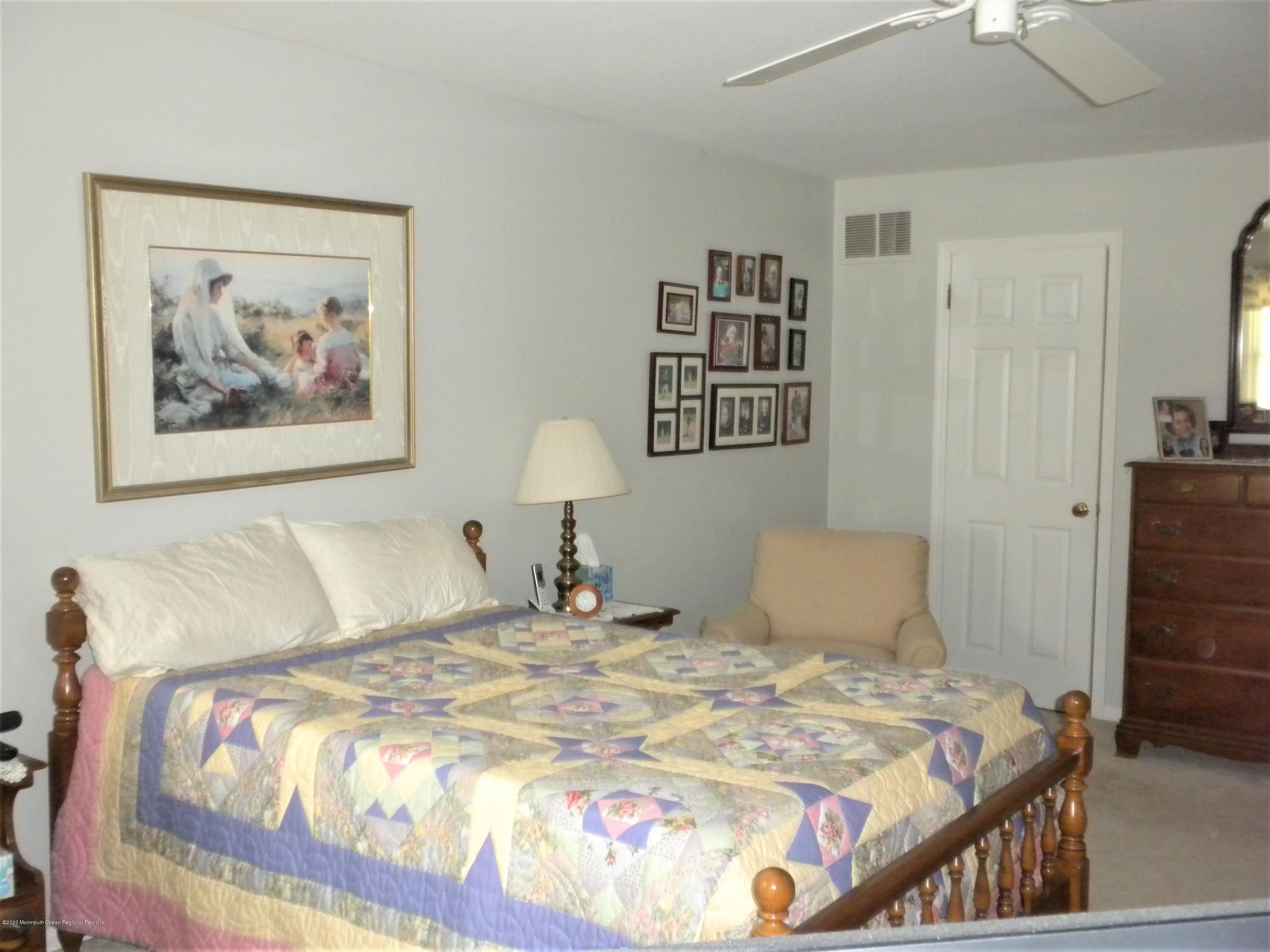 28 Ridge Road West Long Branch, NJ 07764 - Photo 12 of 19 a bedroom with a bed and a painting on the wall