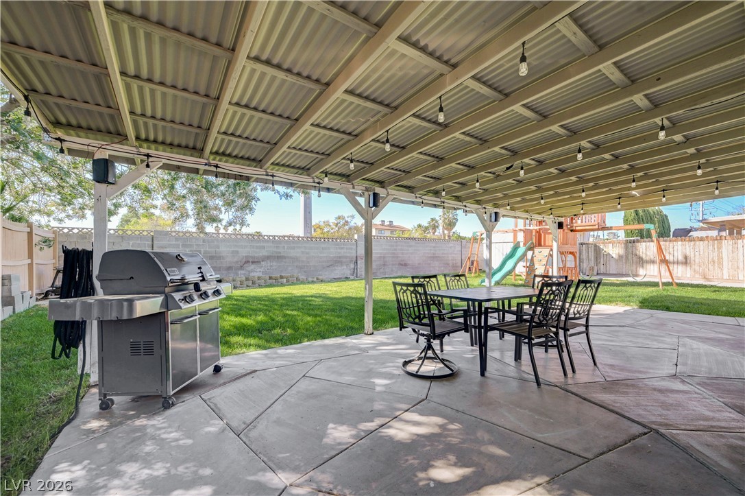 1331 Pinto Road Boulder City, NV 89005 - Photo 5 of 46 A spacious covered patio invites outdoor dining and recreation on a sunny day.
