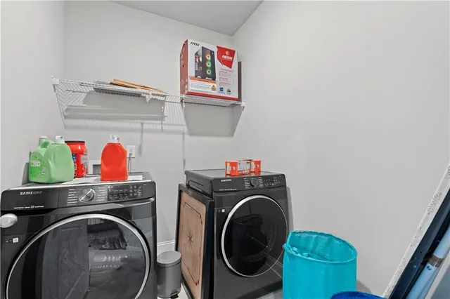 a utility room with dryer and washer