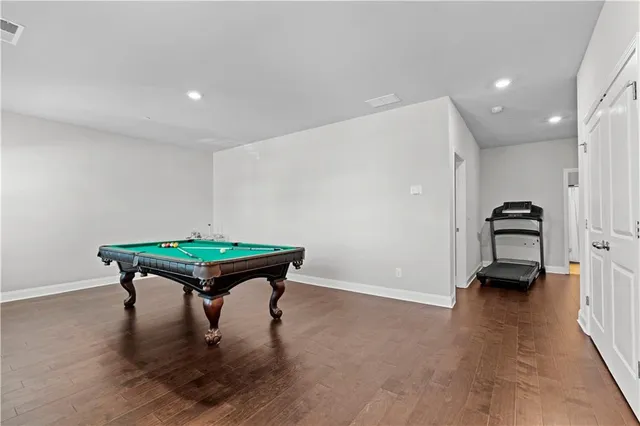 a room with furniture and a wooden floor