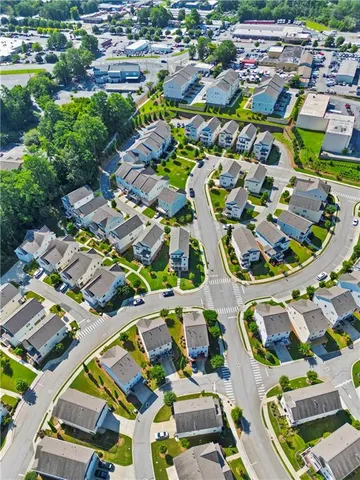 an aerial view of residential houses with outdoor space
