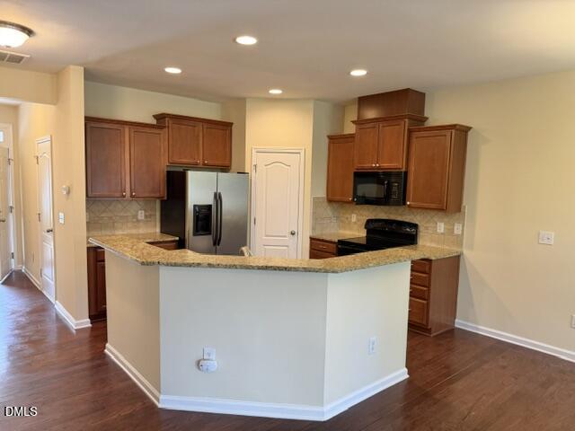 8227 Primanti Boulevard Raleigh, NC 27612 - Photo 8 of 25 a kitchen with stainless steel appliances a refrigerator and a stove top oven