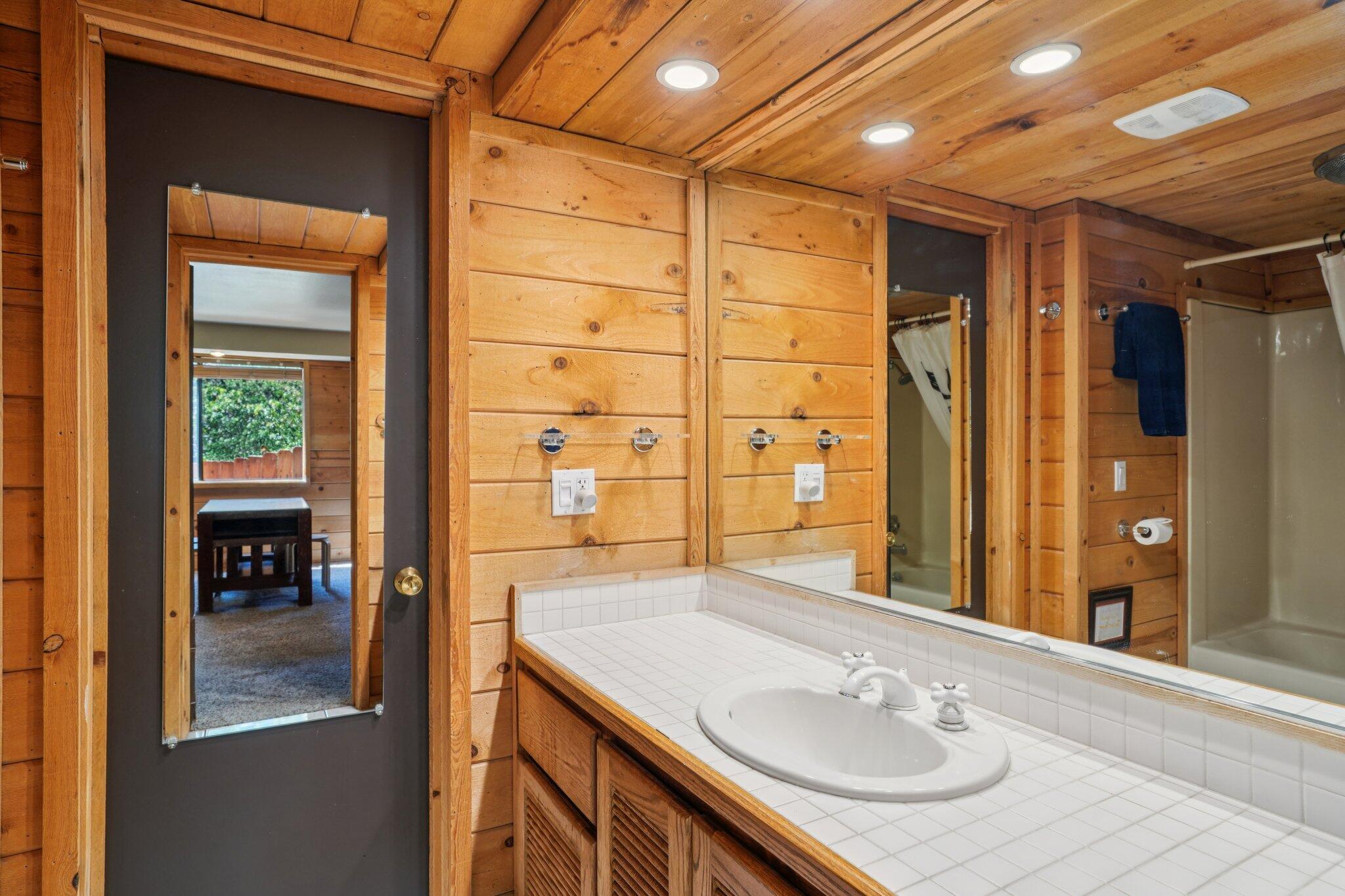 24800 Marion Ridge Drive Idyllwild, CA 92549 - Photo 18 of 39 a bathroom with a sink shower and a mirror
