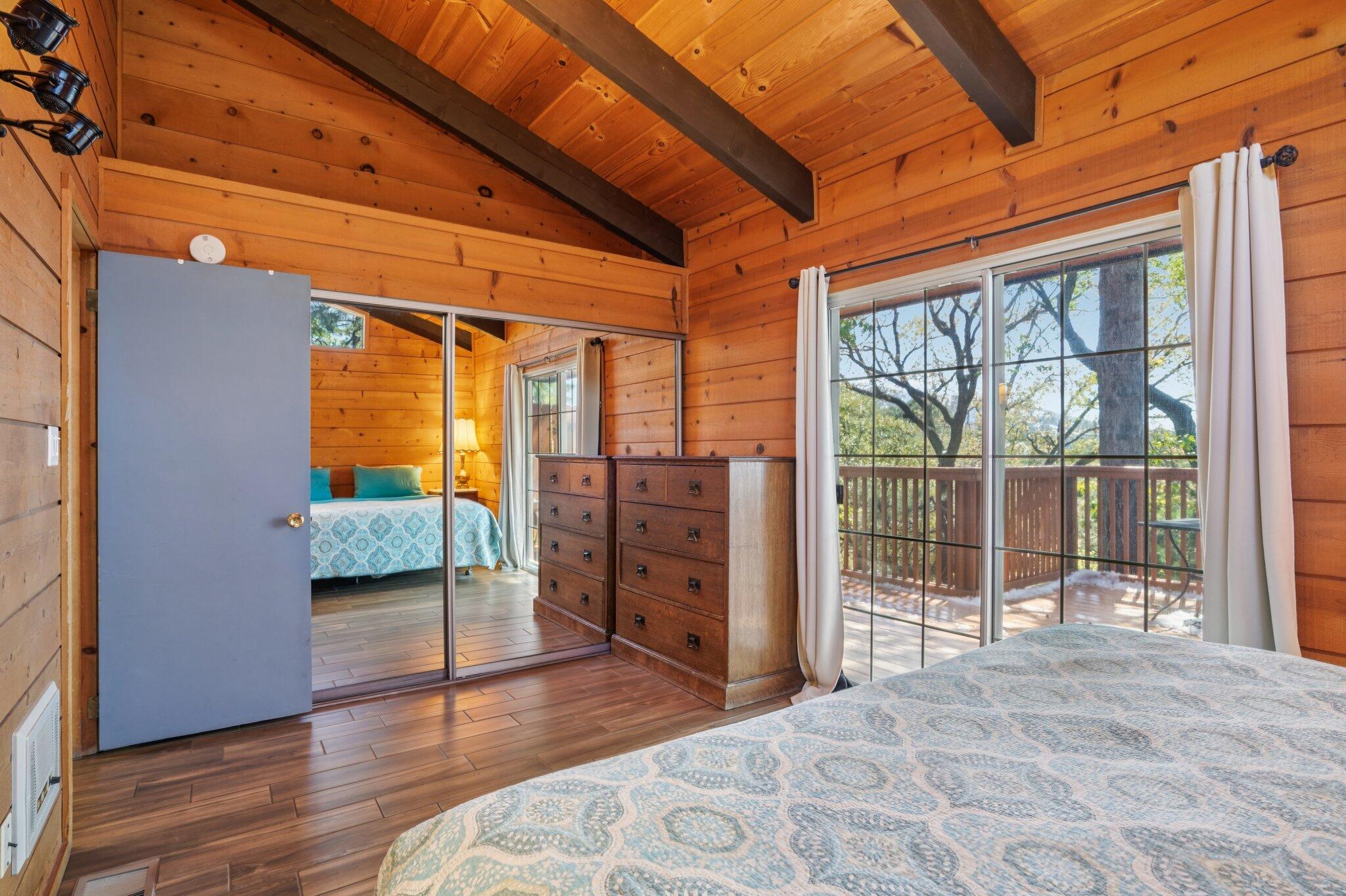 24800 Marion Ridge Drive Idyllwild, CA 92549 - Photo 21 of 39 a bedroom with furniture and large window