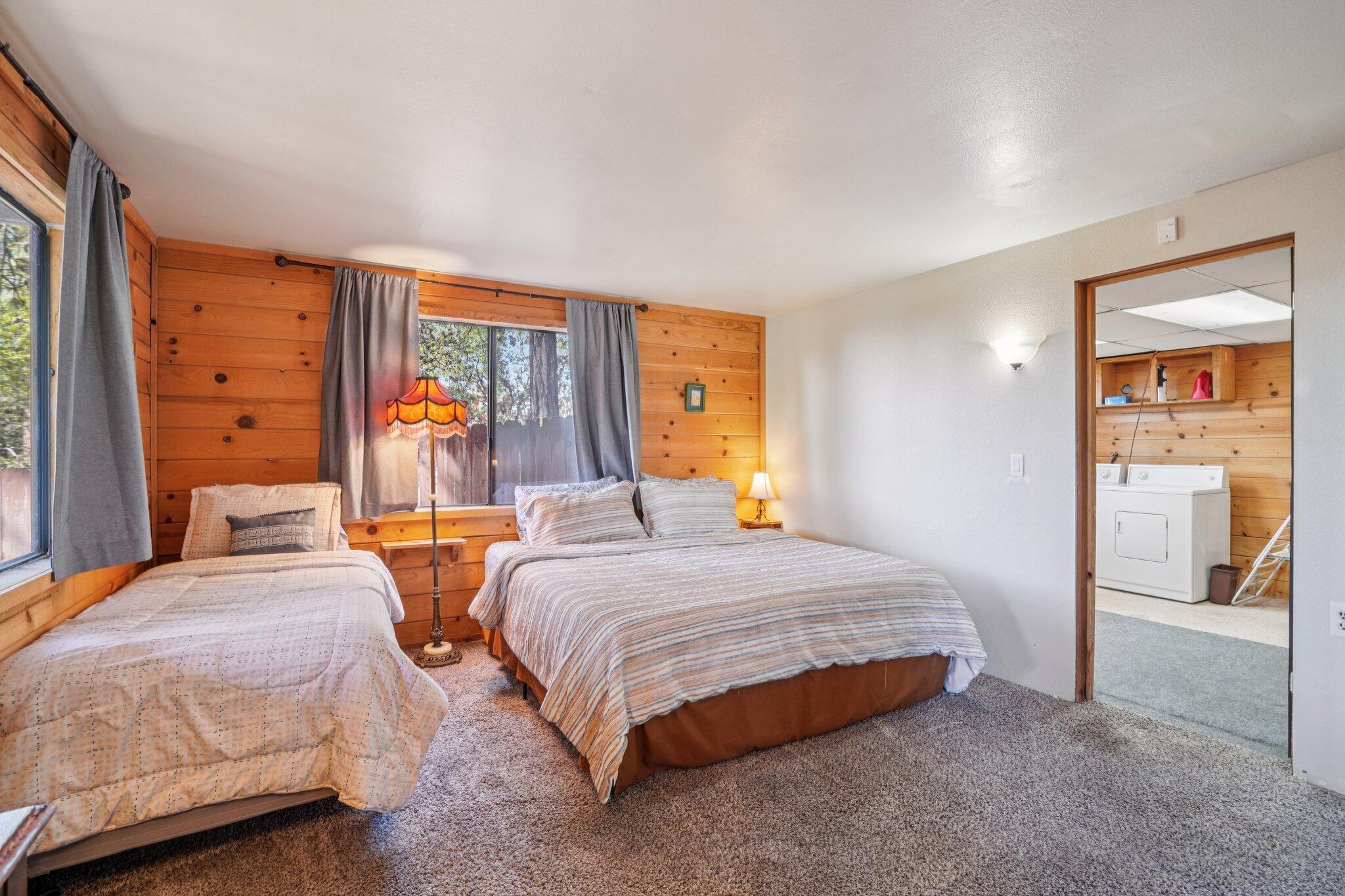 24800 Marion Ridge Drive Idyllwild, CA 92549 - Photo 23 of 39 a bedroom with two beds and painting on the wall