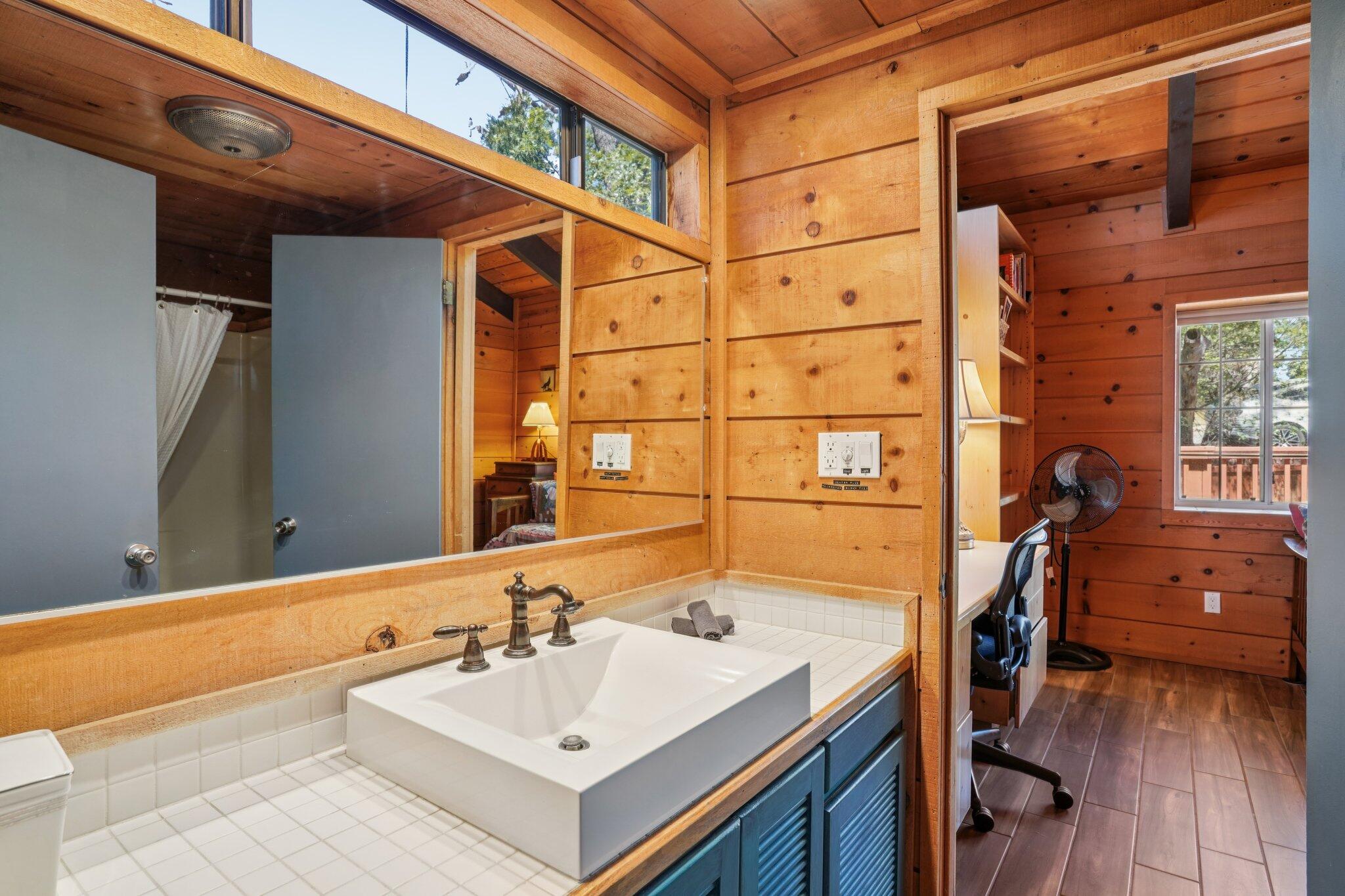 24800 Marion Ridge Drive Idyllwild, CA 92549 - Photo 27 of 39 a bathroom with a sink and a mirror