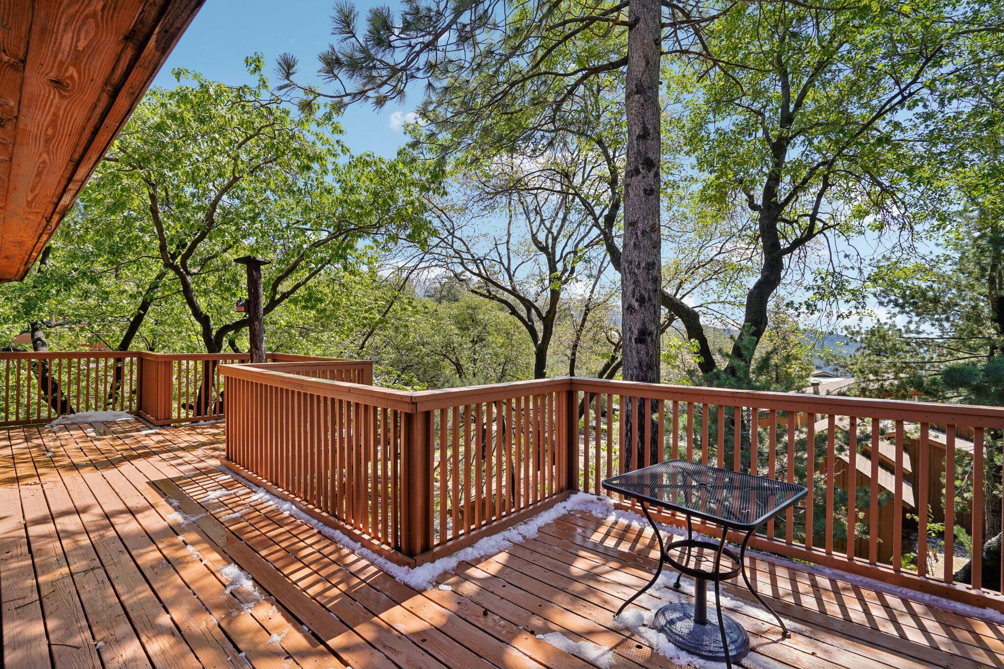 24800 Marion Ridge Drive Idyllwild, CA 92549 - Photo 35 of 39 a view of a wooden deck with a patio