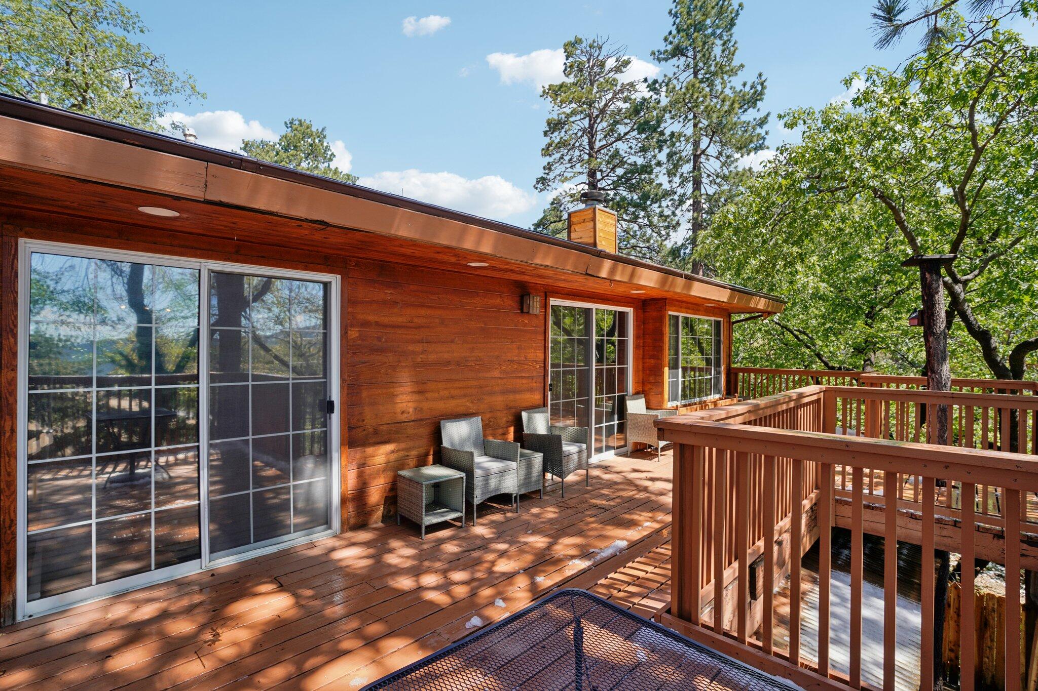 24800 Marion Ridge Drive Idyllwild, CA 92549 - Photo 37 of 39 a view of a deck with wooden floor and fence