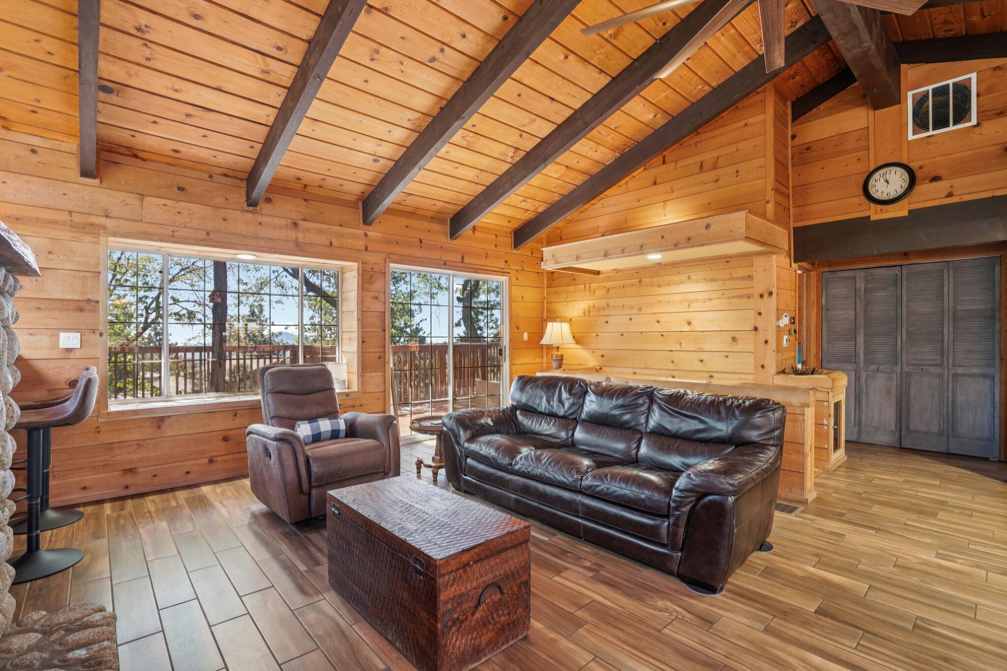 24800 Marion Ridge Drive Idyllwild, CA 92549 - Photo 6 of 39 a living room with furniture a wooden floor and next to a window