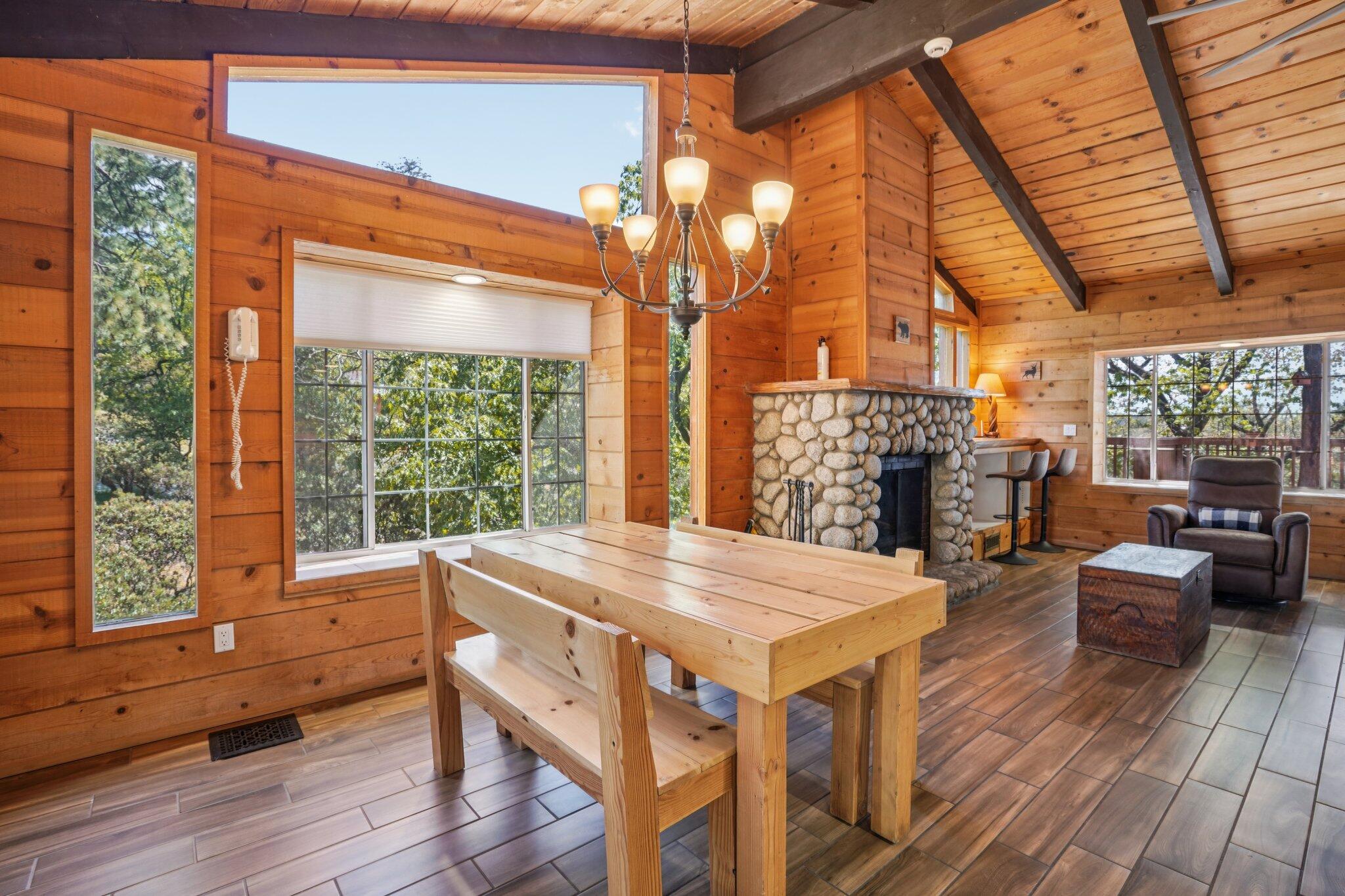 24800 Marion Ridge Drive Idyllwild, CA 92549 - Photo 7 of 39 a view of a dining room with furniture window and wooden floor