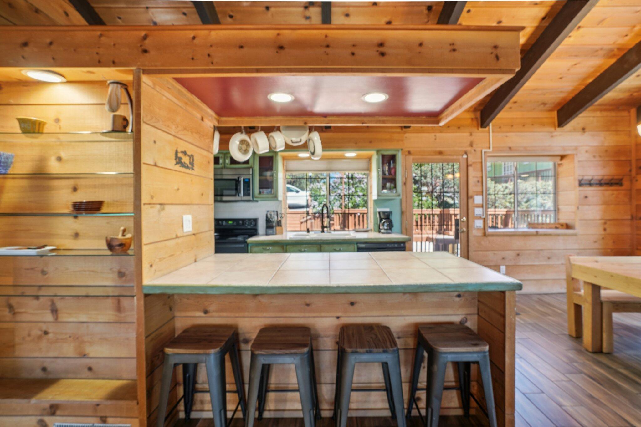 24800 Marion Ridge Drive Idyllwild, CA 92549 - Photo 9 of 39 a dining room with a wooden table and chairs