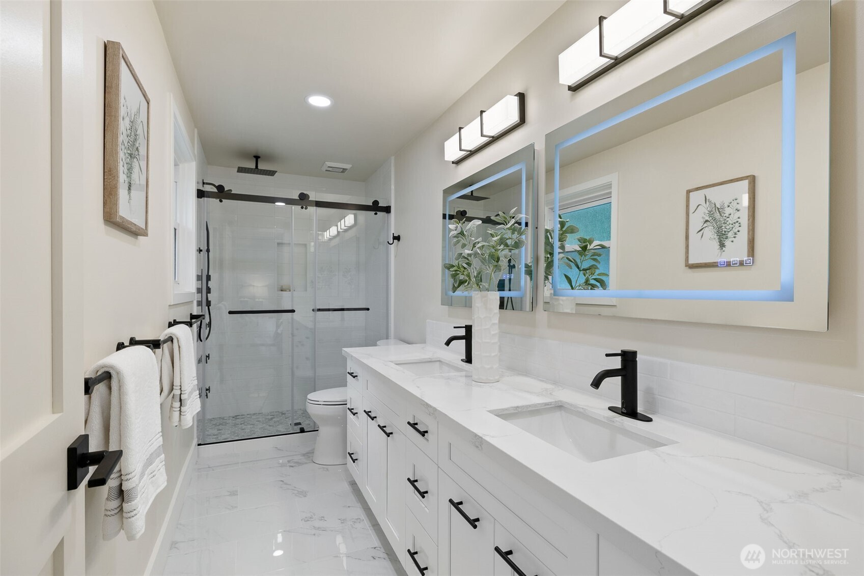 22017 1st Place West Bothell, WA 98021 - Photo 13 of 28 a bathroom with a double vanity sink mirror and shower