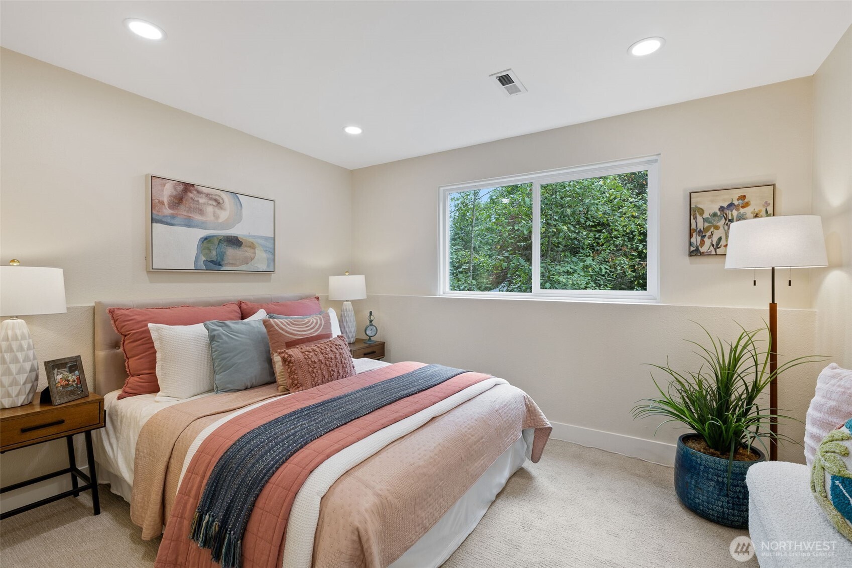 22017 1st Place West Bothell, WA 98021 - Photo 16 of 28 a bedroom with bed and a potted plant