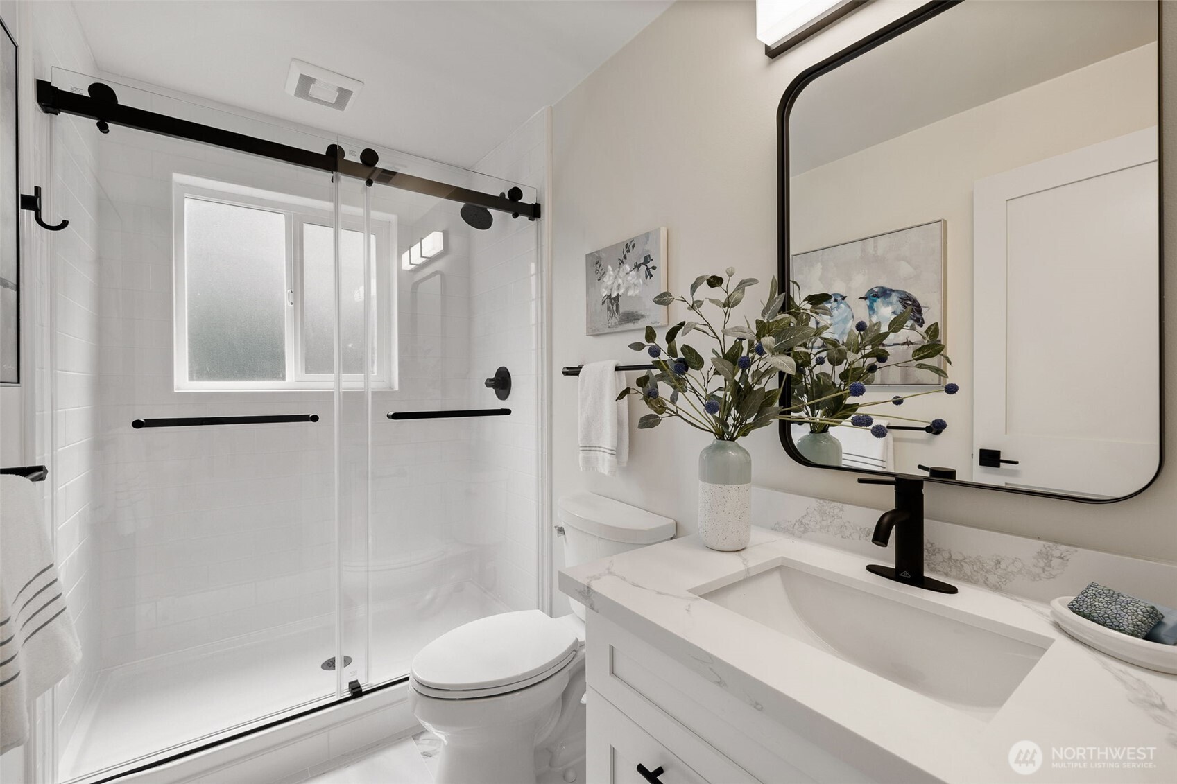 22017 1st Place West Bothell, WA 98021 - Photo 17 of 28 a bathroom with a sink toilet and shower