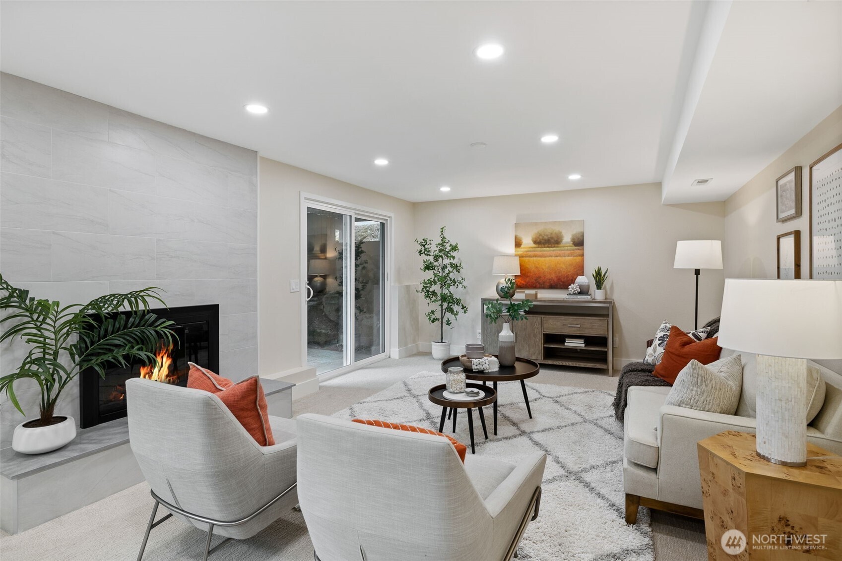 22017 1st Place West Bothell, WA 98021 - Photo 20 of 28 a living room with furniture a fireplace and a potted plant