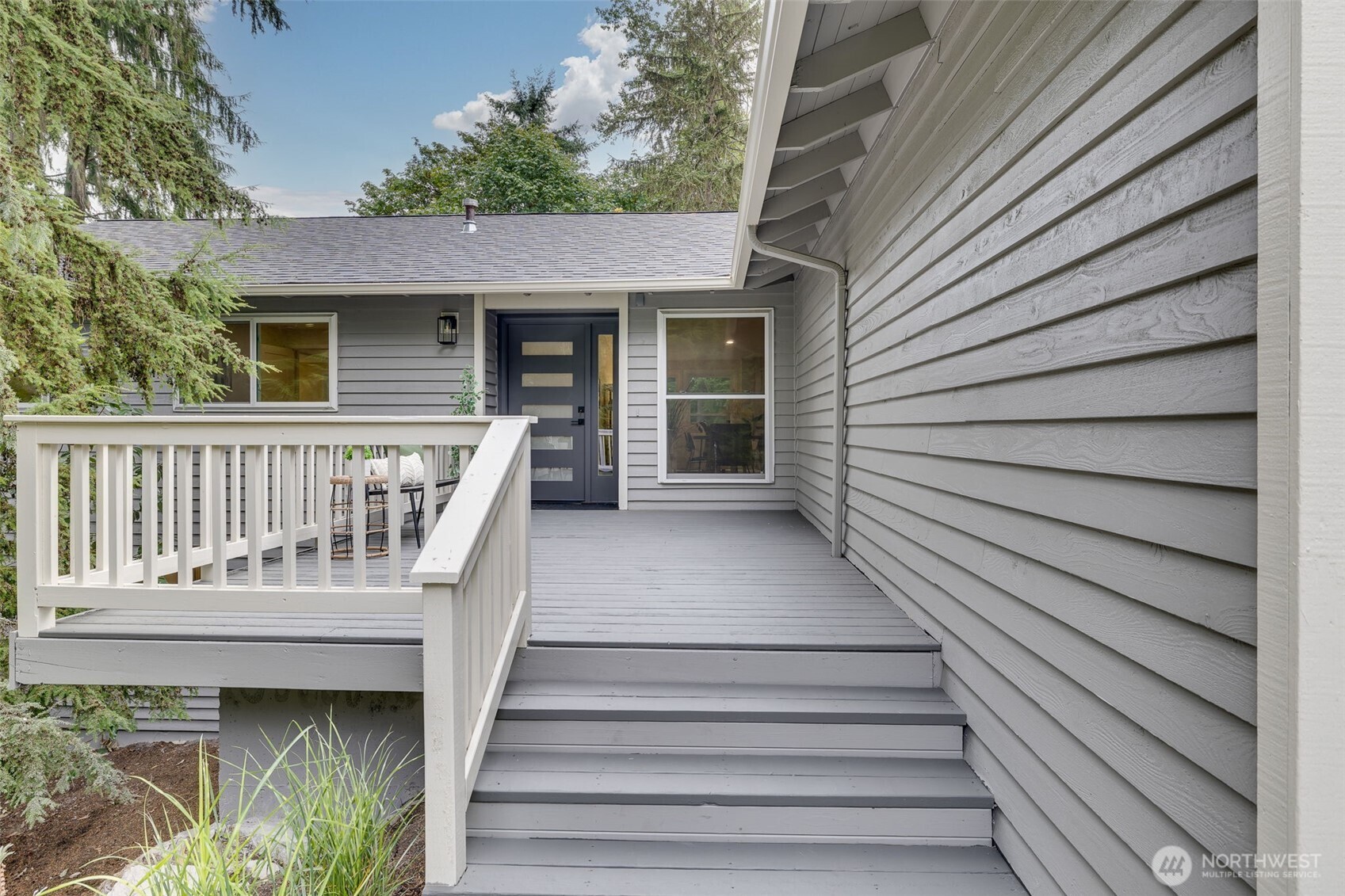 22017 1st Place West Bothell, WA 98021 - Photo 2 of 28 a view of a house with wooden deck
