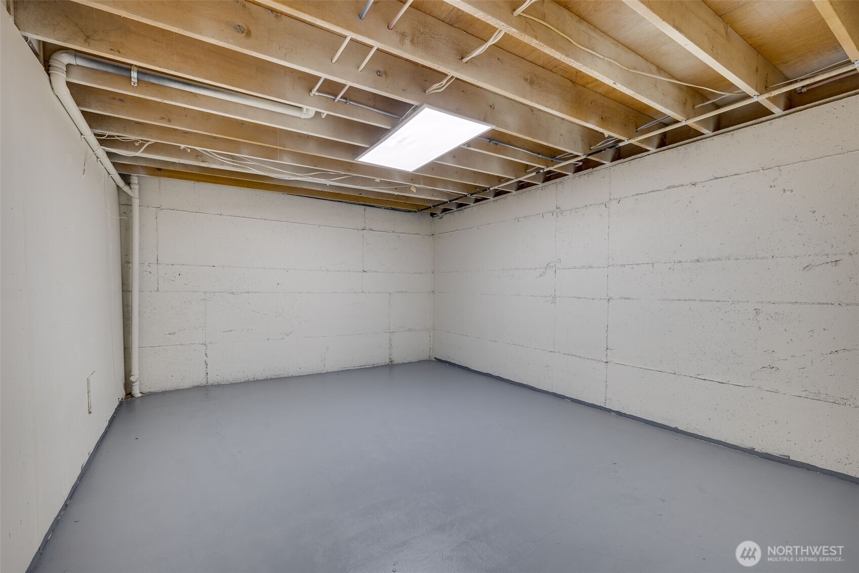 22017 1st Place West Bothell, WA 98021 - Photo 22 of 28 a view of a room with racks on the wall