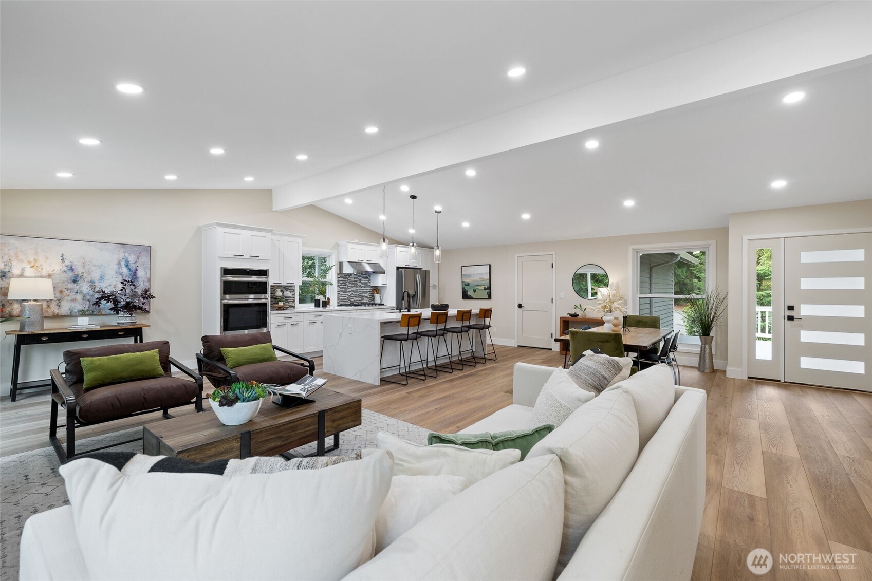 22017 1st Place West Bothell, WA 98021 - Photo 4 of 28 a living room with furniture kitchen view and a wooden floor