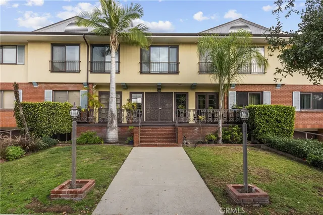 a front view of a house with a yard and porch