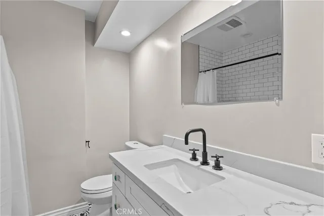 a bathroom with a sink and a toilet