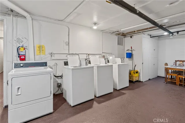 a view of parking garage with cars parked