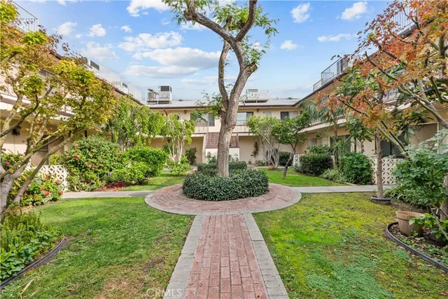 a view of a garden with a fountain